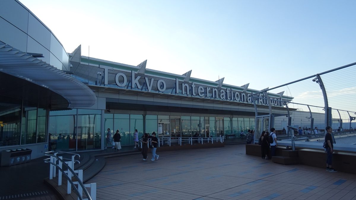 Visitors on the observation deck at Haneda Airport Terminal 3, watching aircraft on the apron